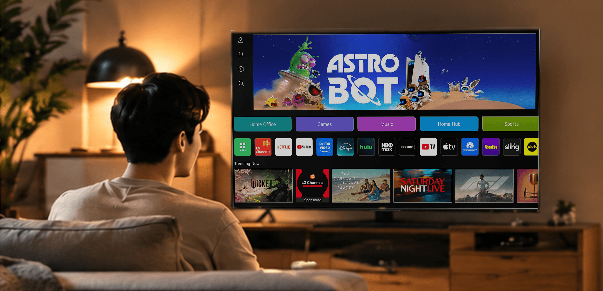 A viewer watching a connected-TV home screen in their living room — the CTV touchpoint RZR connects to mobile outcomes.